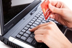 Credit card in hand for buying online
