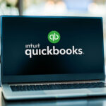 a computer screen with quickbooks branding on it